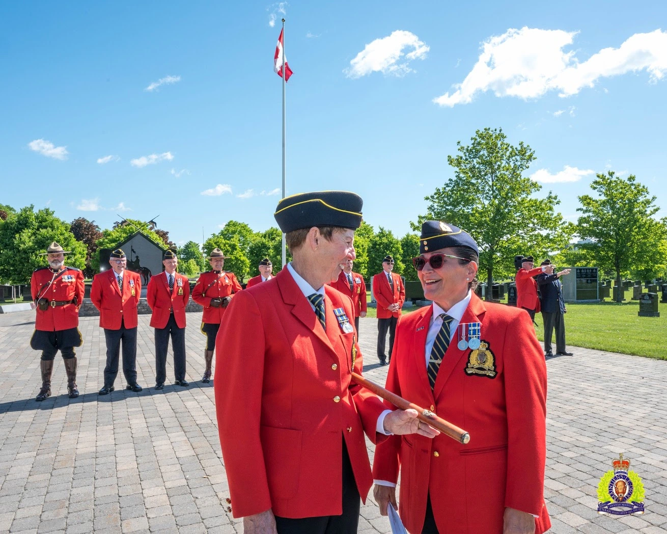 RCMPVA - What We Do RCMP Veterans Chris Windover (left) and Luisa Russo-Lemay (right) conferring before calling the ceremonial troop together for the annual vigil ceremony at RCMP National Memorial Cemetery at Beechwood, Ottawa, Ontario. May 23, 2024.